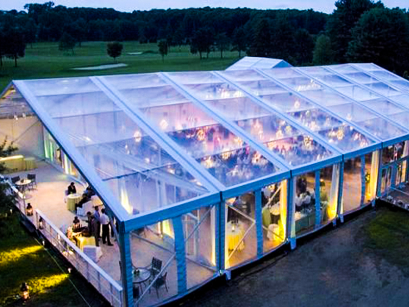 What is the function of the glass curtain wall of the tent?